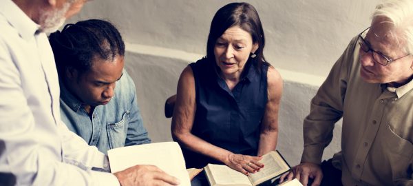 Group christianity people reading bible together